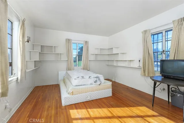 an empty room with furniture and window