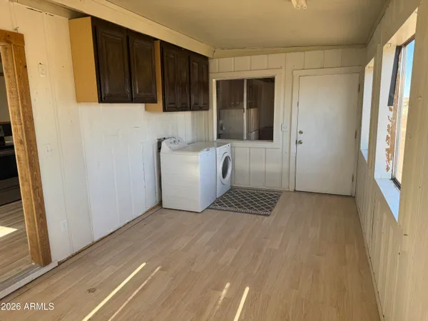 a view of kitchen with furniture and cabinets