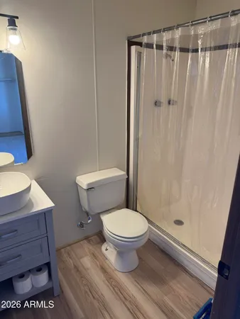 a bathroom with a toilet and a shower