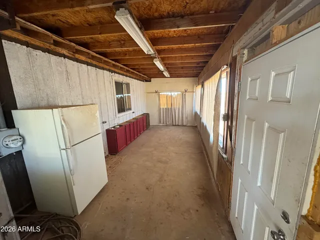 a view of a refrigerator in a kitchen
