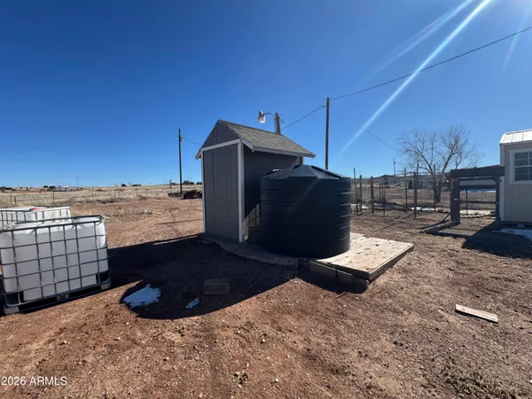 a view of a backyard of the house