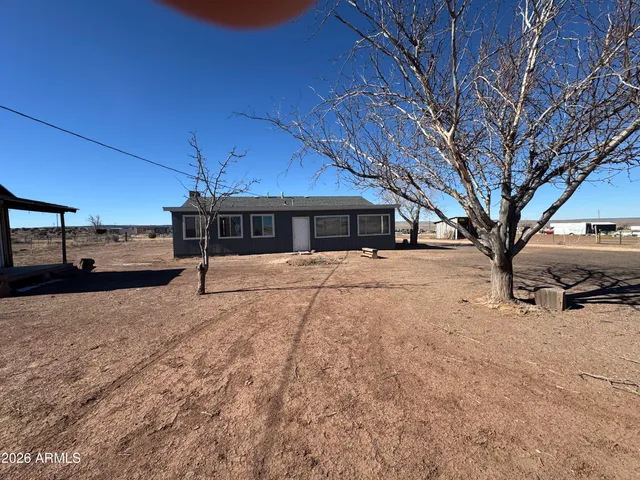 a view of a house with a snow in the yard