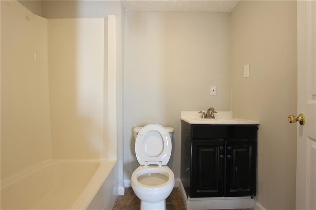3085 Creel Road College Park, GA 30349 - Photo 24 of 38 a bathroom with a toilet and a sink