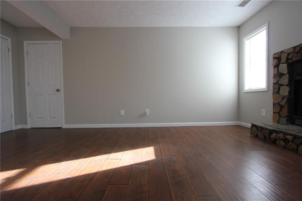3085 Creel Road College Park, GA 30349 - Photo 7 of 38 a view of empty room with wooden floor and fan