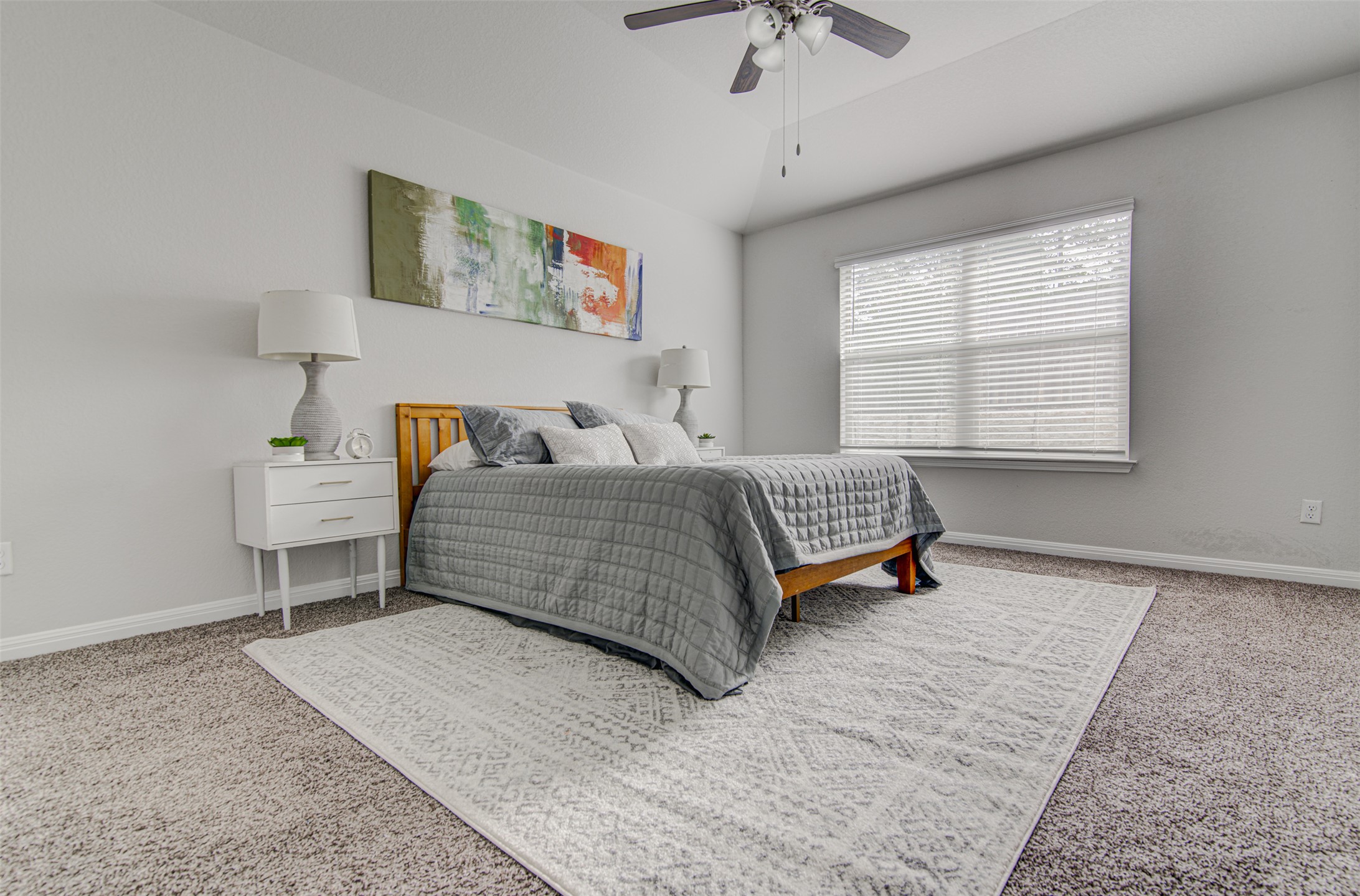 316 Pepper Mill Loop Burnet, TX 78611 - Photo 12 of 27 Relax in this tranquil bedroom, featuring a generous window and a ceiling fan for year-round comfort.