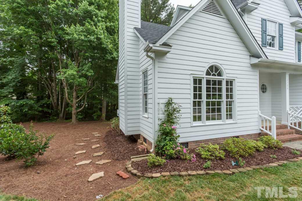 12304 Hartwick Court Raleigh, NC 27613 - Photo 13 of 14 a view of house with backyard and garden