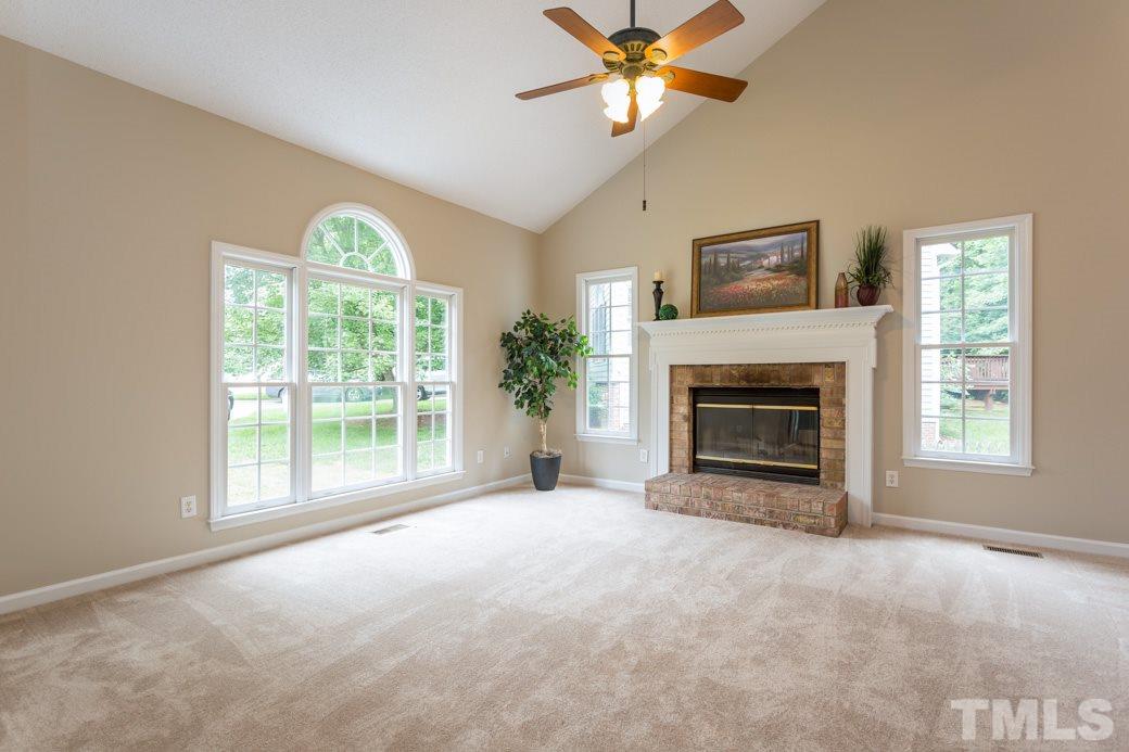 12304 Hartwick Court Raleigh, NC 27613 - Photo 5 of 14 a view of livingroom with furniture window and fireplace