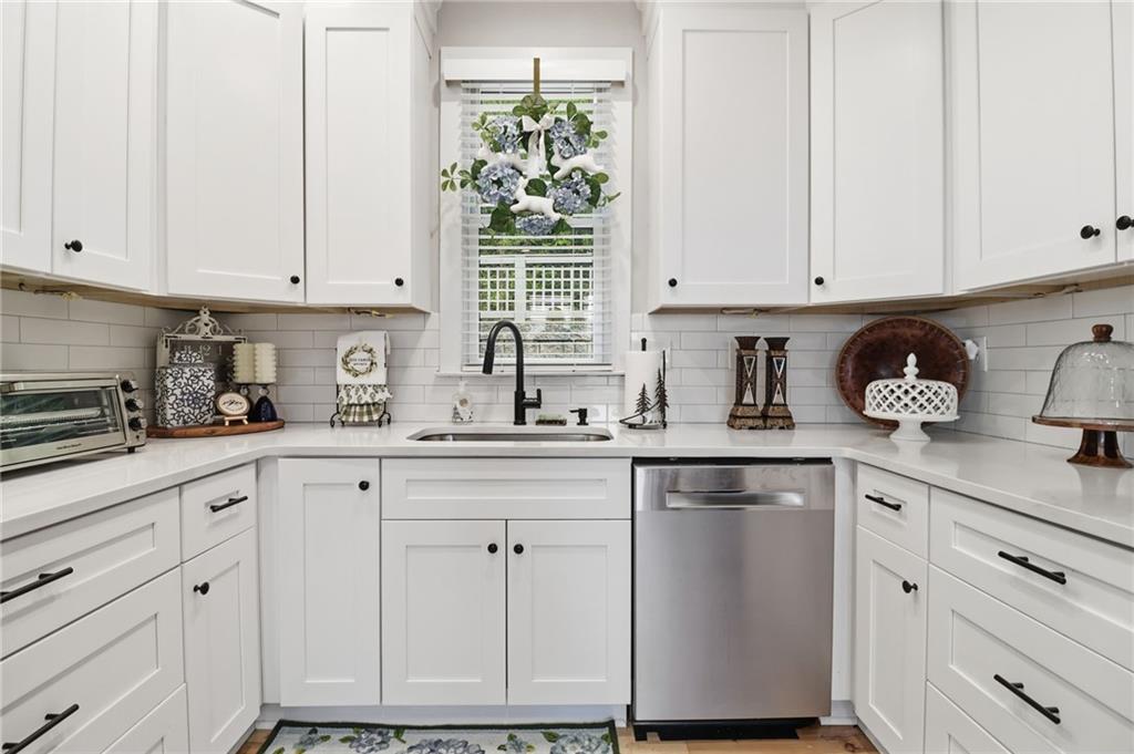 59 Falcon Heights Jasper, GA 30143 - Photo 17 of 47 a kitchen with white cabinets and sink