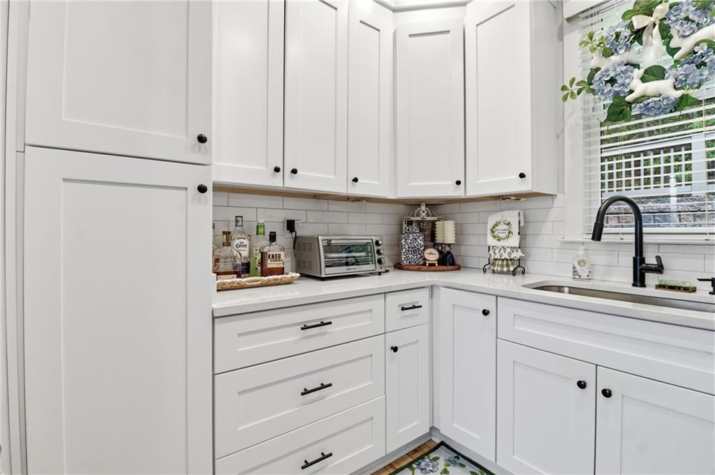 59 Falcon Heights Jasper, GA 30143 - Photo 23 of 47 a kitchen with white cabinets and sink