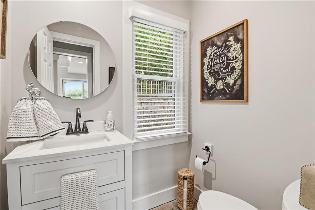 59 Falcon Heights Jasper, GA 30143 - Photo 24 of 47 a bathroom with a toilet a sink and a mirror