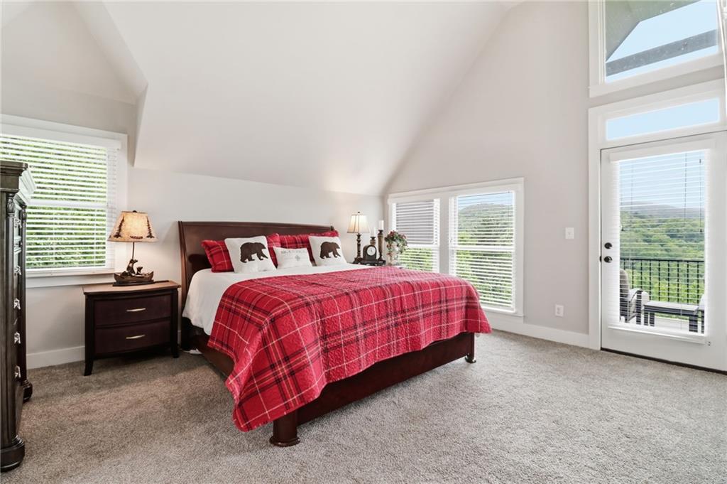 59 Falcon Heights Jasper, GA 30143 - Photo 26 of 47 a spacious bedroom with a bed and a large window