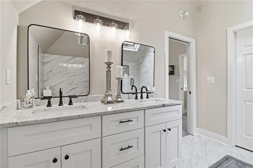 59 Falcon Heights Jasper, GA 30143 - Photo 28 of 47 a bathroom with double vanity sink and a mirror