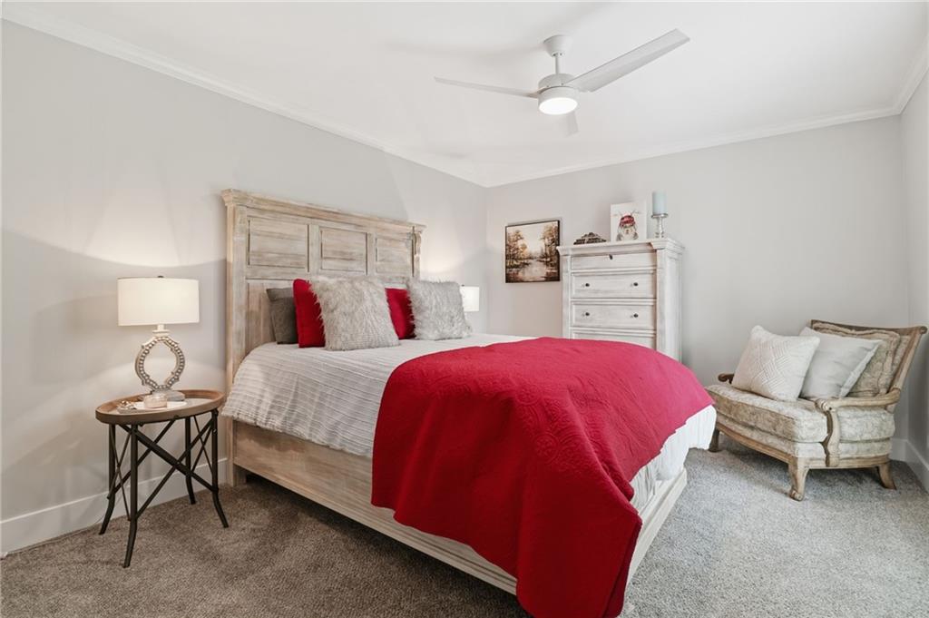 59 Falcon Heights Jasper, GA 30143 - Photo 36 of 47 a spacious bedroom with a bed and a couch