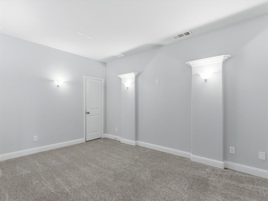 2217 Commons Way Prosper, TX 75078 - Photo 19 of 37 Spare room featuring light carpet and baseboards