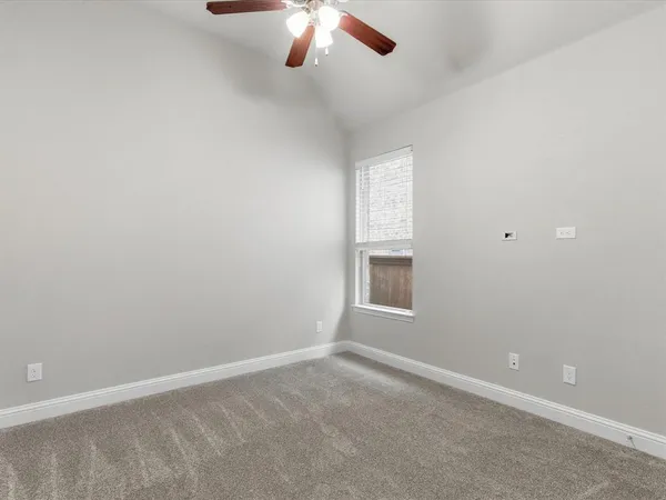 an empty room with a empty space and a window