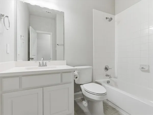 a bathroom with a sink a toilet and a bathtub