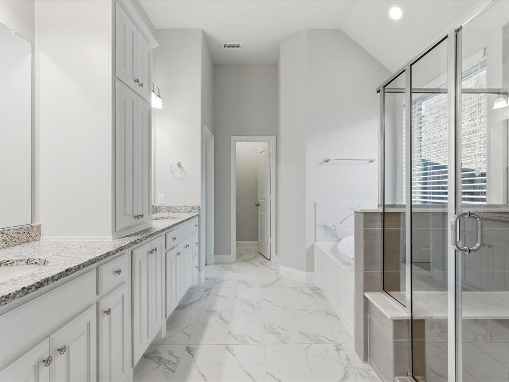 2217 Commons Way Prosper, TX 75078 - Photo 30 of 37 Bathroom featuring a shower stall, vanity, a garden tub, recessed lighting, and light marble finish floors