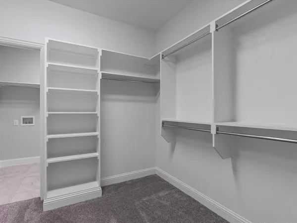 a view of an empty walk in closet