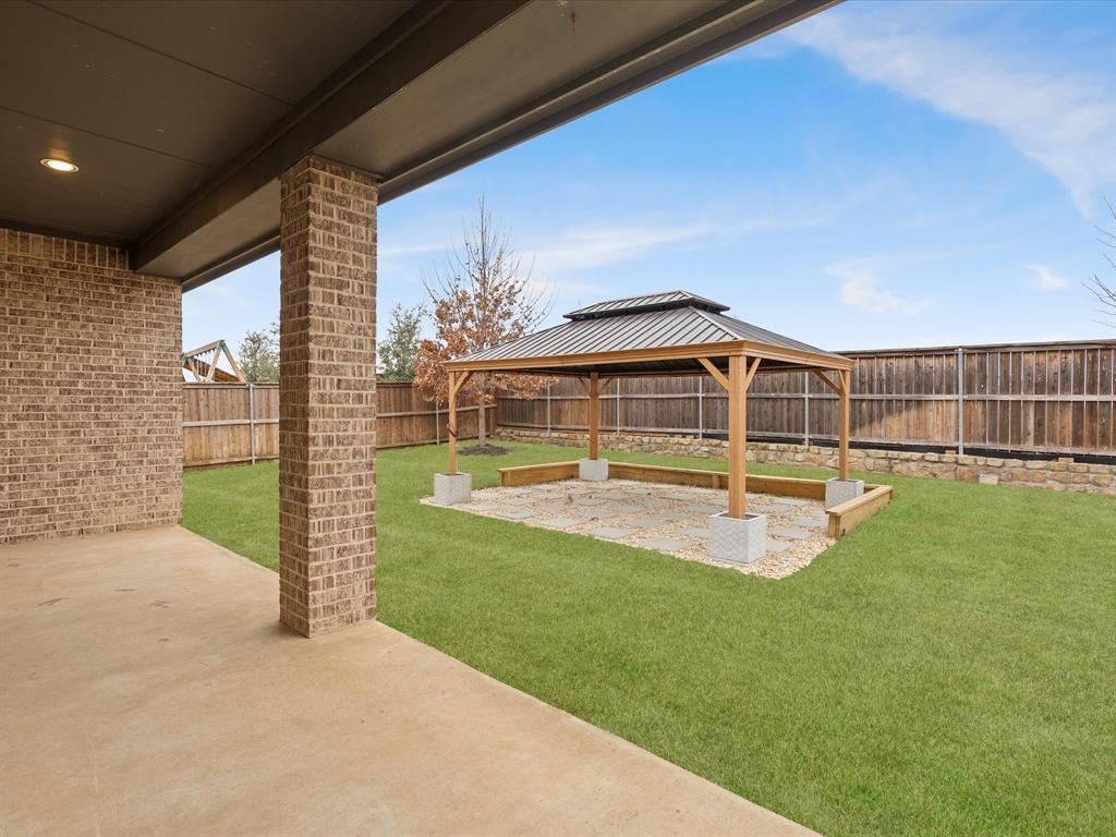 2217 Commons Way Prosper, TX 75078 - Photo 35 of 37 Fenced backyard featuring a patio and a gazebo
