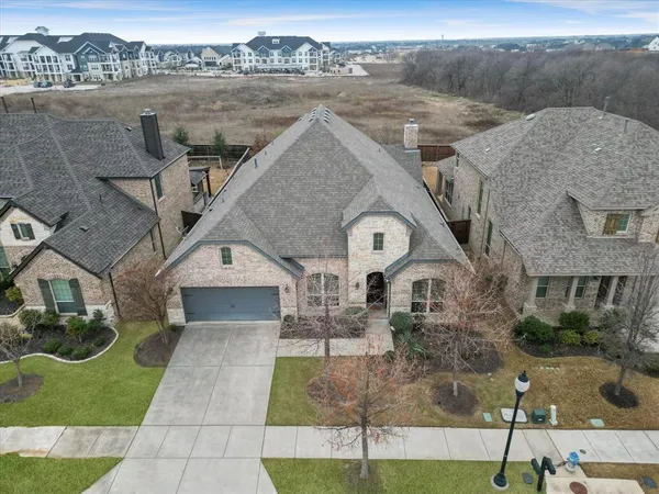 a aerial view of a house with a yard