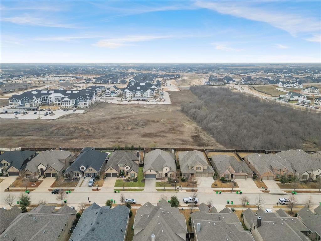 2217 Commons Way Prosper, TX 75078 - Photo 5 of 37 Aerial perspective of suburban area
