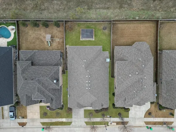 a aerial view of a brick house with a outdoor space