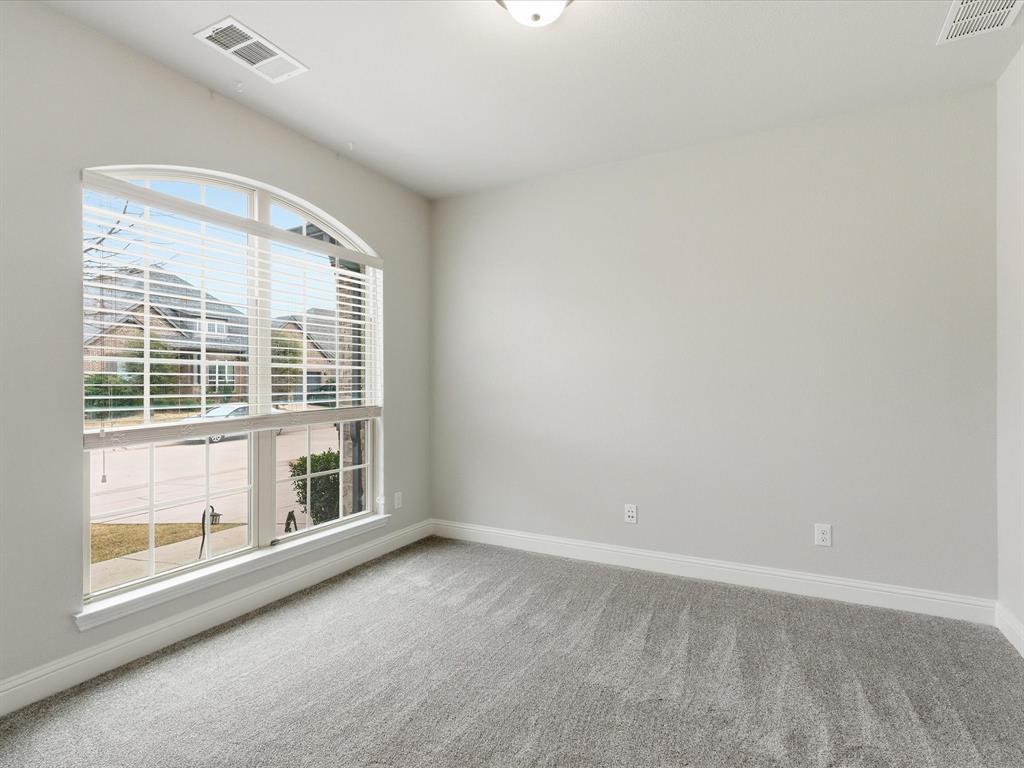 2217 Commons Way Prosper, TX 75078 - Photo 8 of 37 Carpeted spare room with baseboards