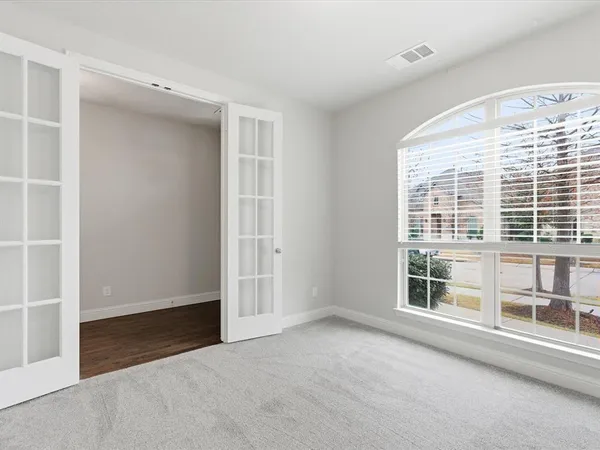 an empty room with windows