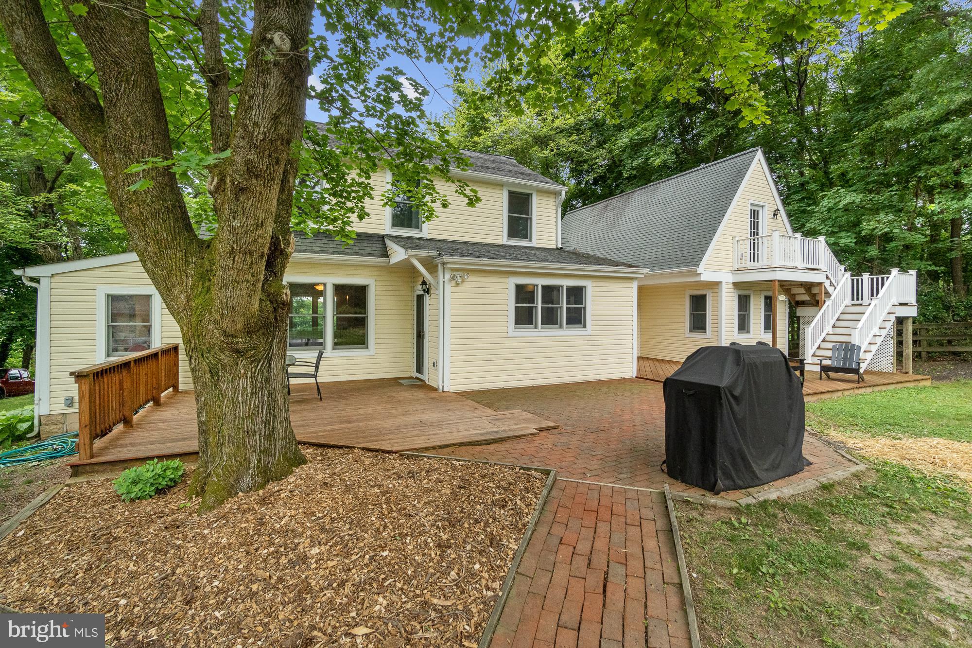 21720 Beallsville Road Barnesville, MD 20838 - Photo 5 of 88 Rear patio is a combination of stone and wood