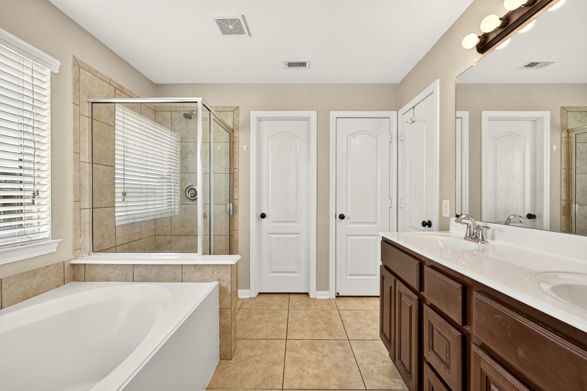 6446 Tea Tree Drive Katy, TX 77494 - Photo 21 of 39 Primary Bathroom -
Separate bath and shower for added luxury. Two sinks is also a bonus.