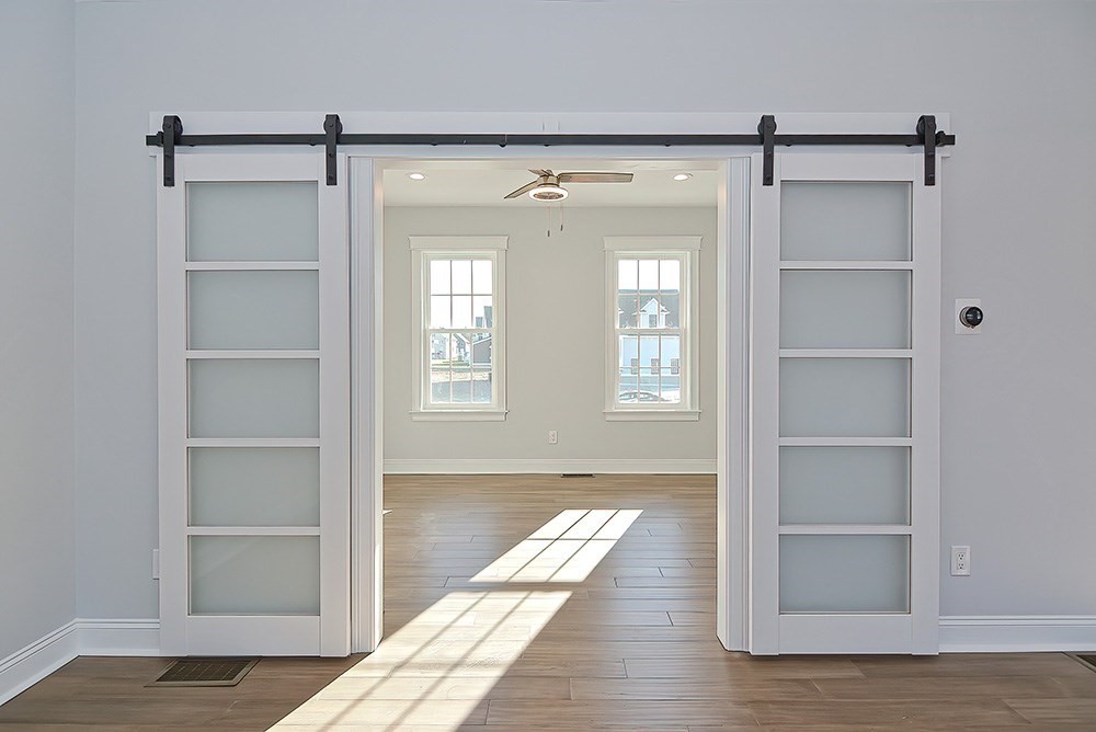 Lot 1 Clubhouse Way Rehoboth, MA 02769 - Photo 7 of 9 a view of an empty room with wooden floor and a window