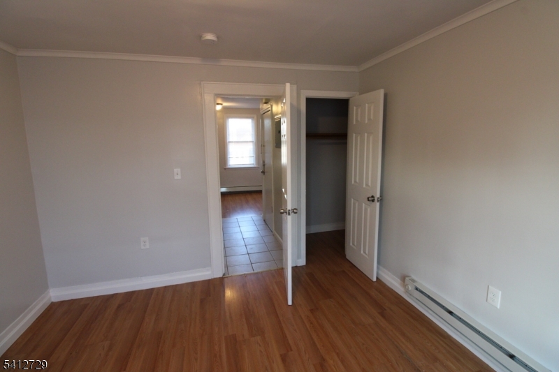 196 Shephard Avenue, Unit 3 Newark, NJ 07112 - Photo 7 of 12 a view of empty room with wooden floor