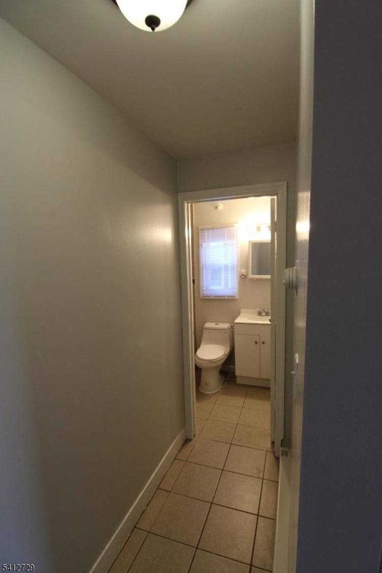 196 Shephard Avenue, Unit 3 Newark, NJ 07112 - Photo 8 of 12 a bathroom with a toilet