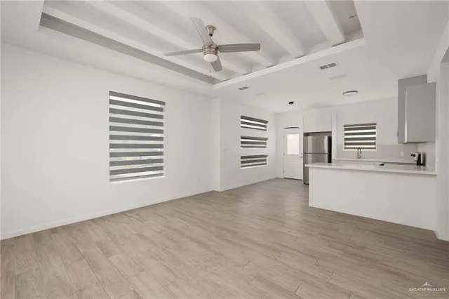 a view of an empty room with a window