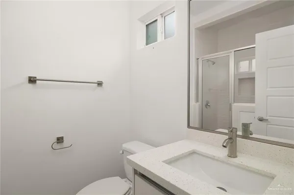 a bathroom with a sink and a toilet