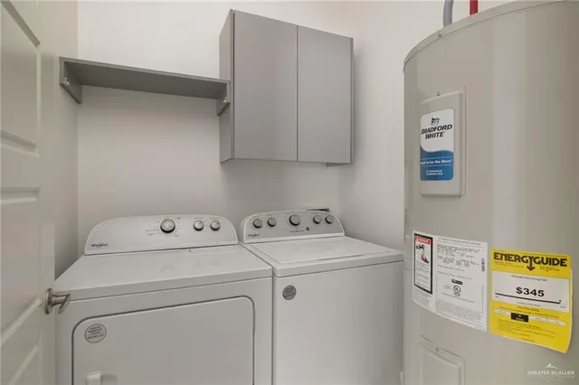 a view of storage and utility room with washer and dryer