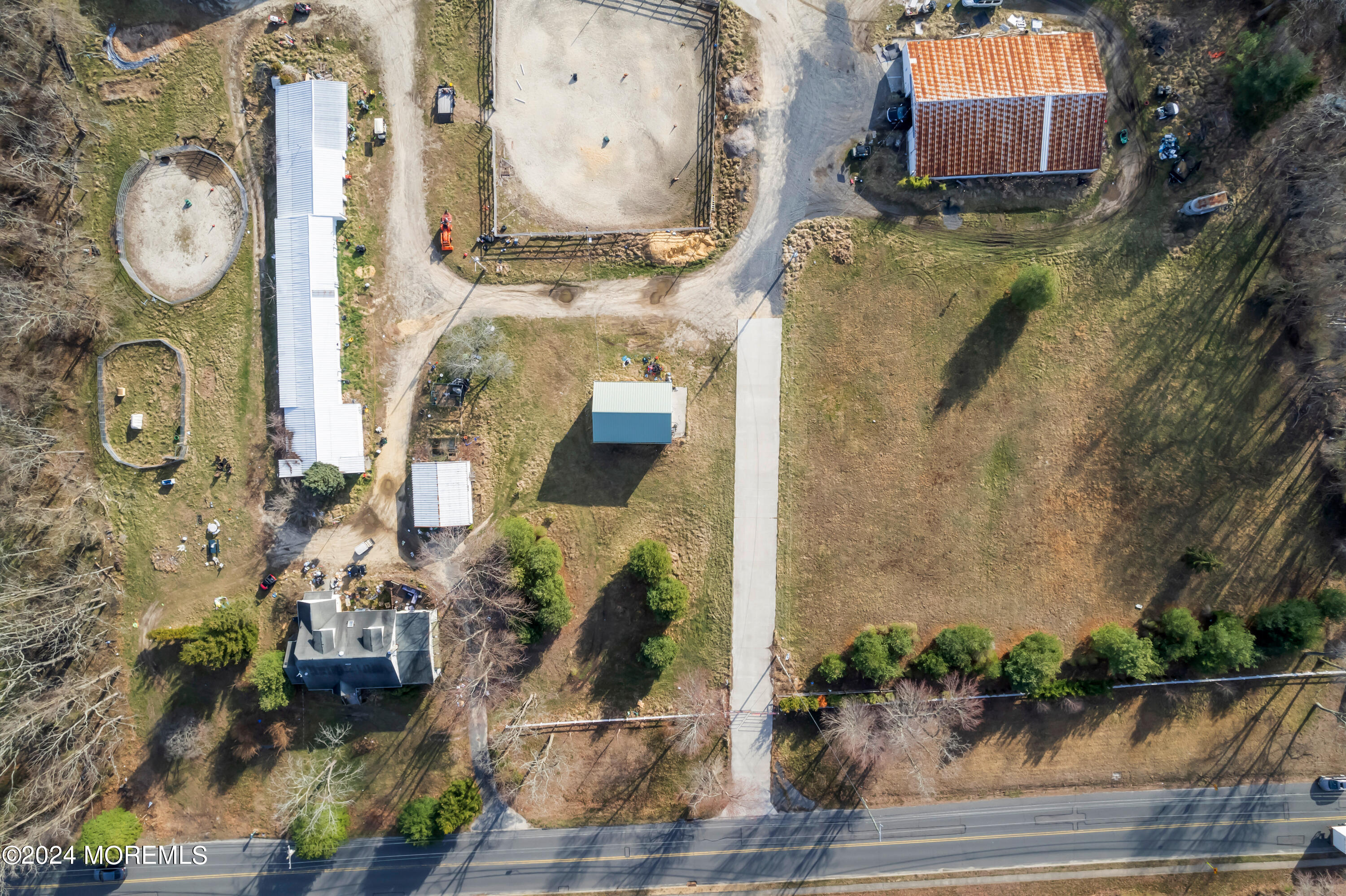 an aerial view of a residential houses with outdoor space