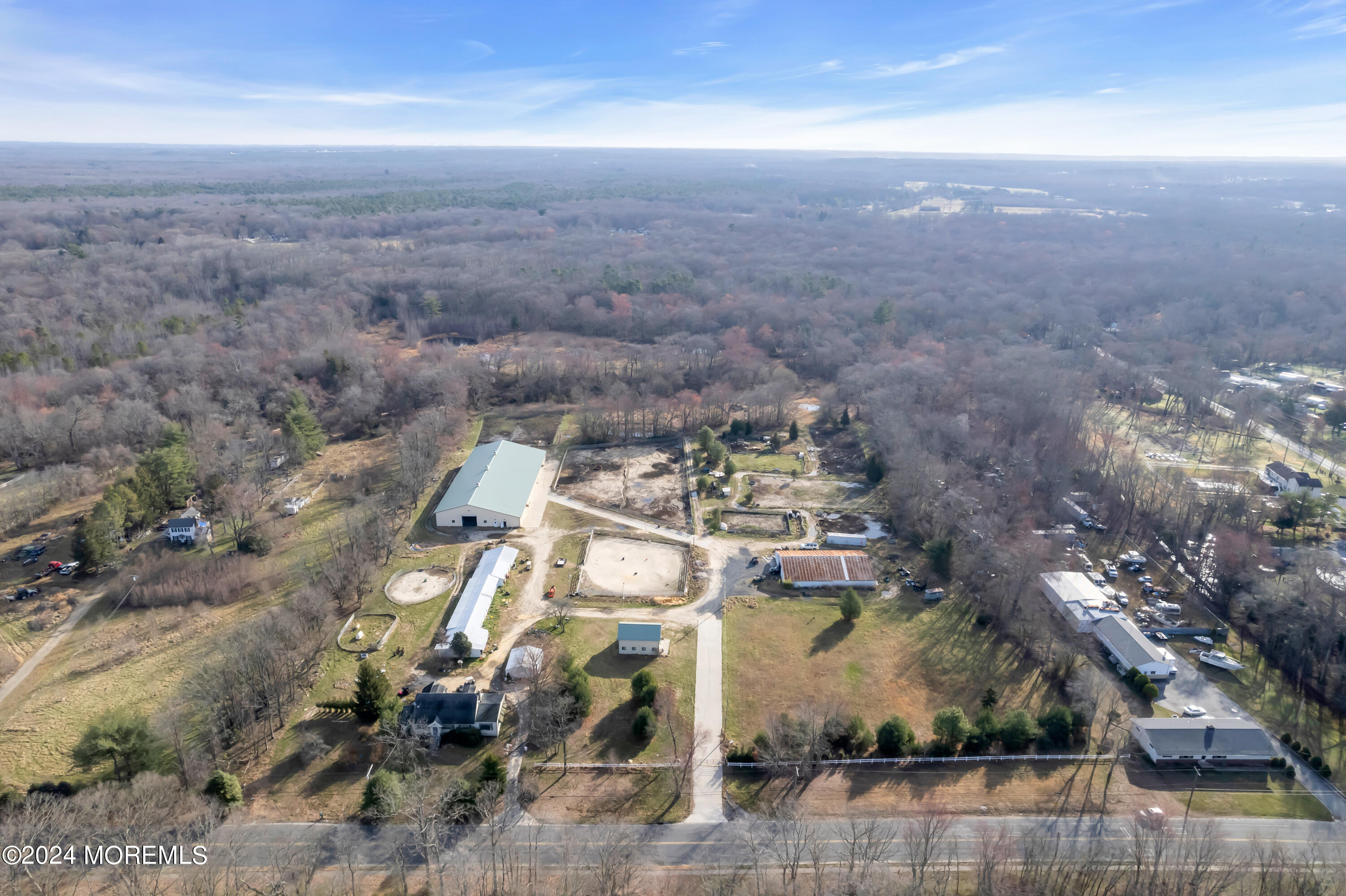 251 Oak Glen Road Howell, NJ 07731 - Photo 24 of 24 an aerial view of a house with a yard and mountain view in back