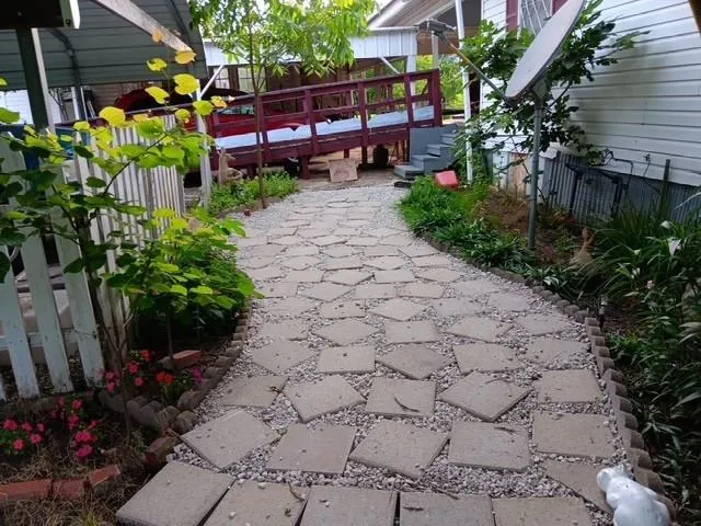 a view of a backyard with sitting area