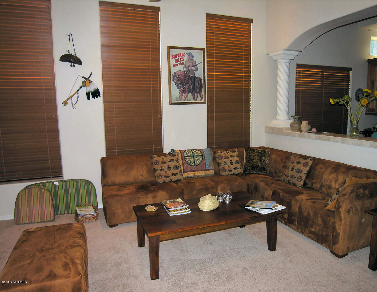 11517 East Ranch Gate Road Scottsdale, AZ 85255 - Photo 13 of 35 a living room with furniture and a potted plant