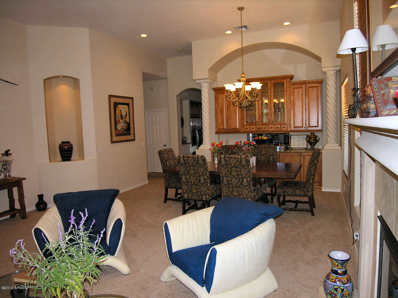 11517 East Ranch Gate Road Scottsdale, AZ 85255 - Photo 14 of 35 a living room with furniture flowers and a chandelier