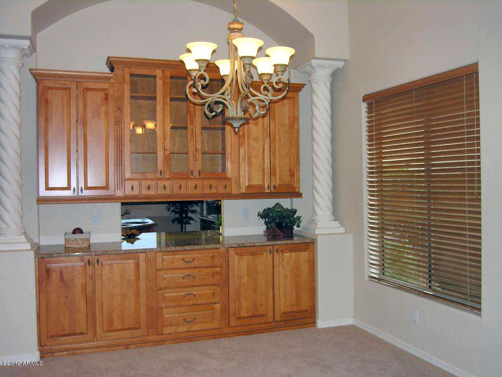 11517 East Ranch Gate Road Scottsdale, AZ 85255 - Photo 15 of 35 a bathroom with a sink a mirror and a window
