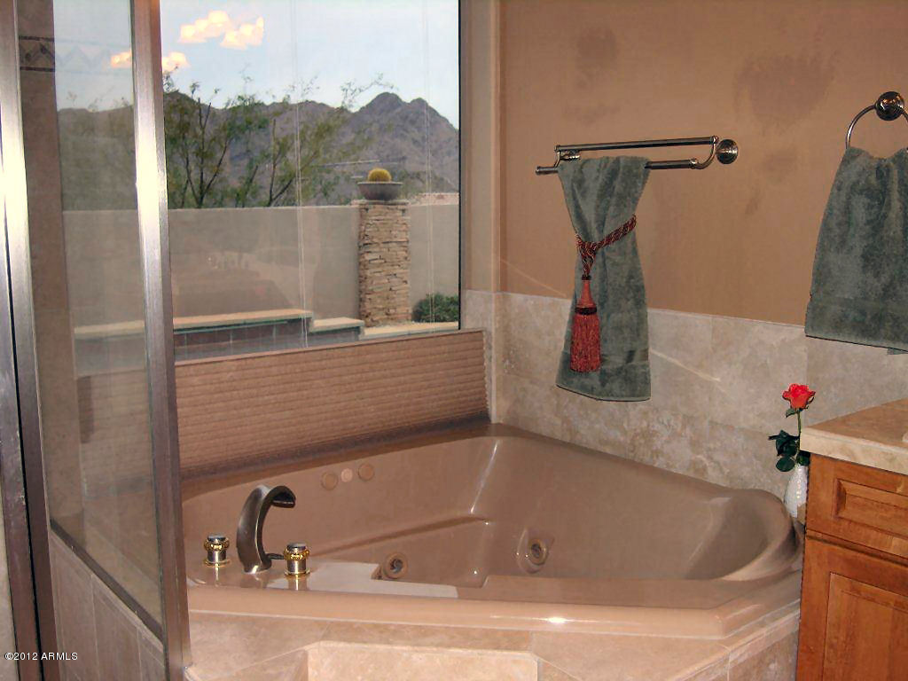 11517 East Ranch Gate Road Scottsdale, AZ 85255 - Photo 18 of 35 a bathroom with a bath tub
