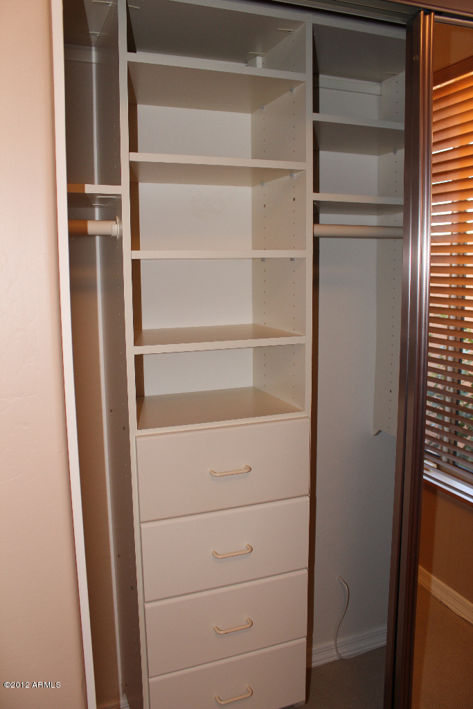 11517 East Ranch Gate Road Scottsdale, AZ 85255 - Photo 19 of 35 a view of walk in closet with empty racks