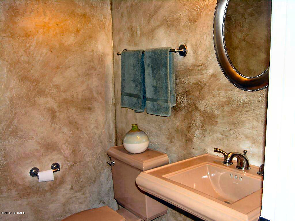 11517 East Ranch Gate Road Scottsdale, AZ 85255 - Photo 25 of 35 a bathroom with a sink a toilet and shower
