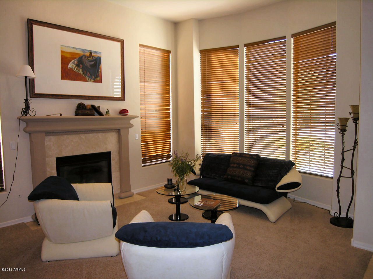 11517 East Ranch Gate Road Scottsdale, AZ 85255 - Photo 28 of 35 a living room with furniture and a fireplace