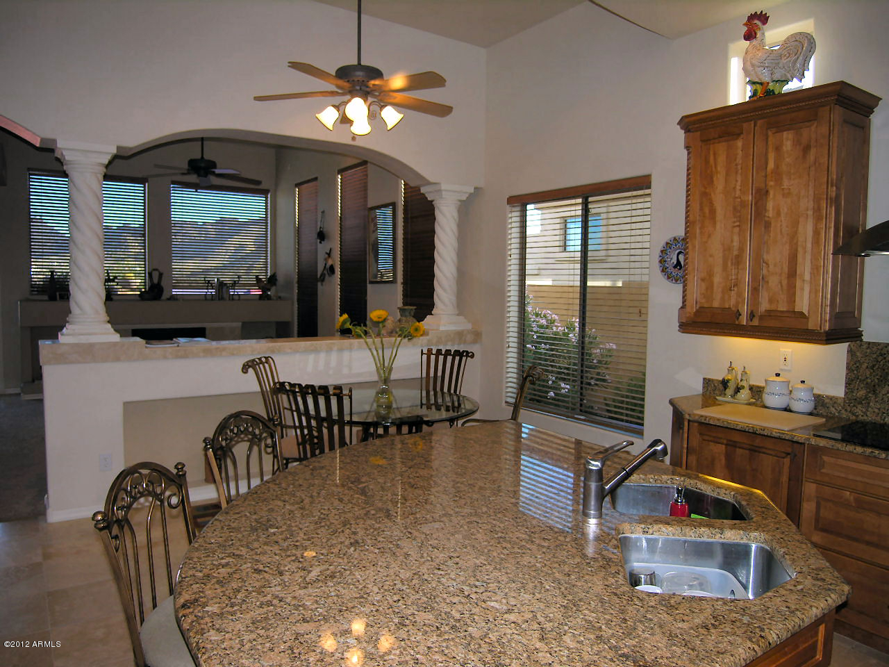 11517 East Ranch Gate Road Scottsdale, AZ 85255 - Photo 29 of 35 a living room with furniture a chandelier and a flat screen tv