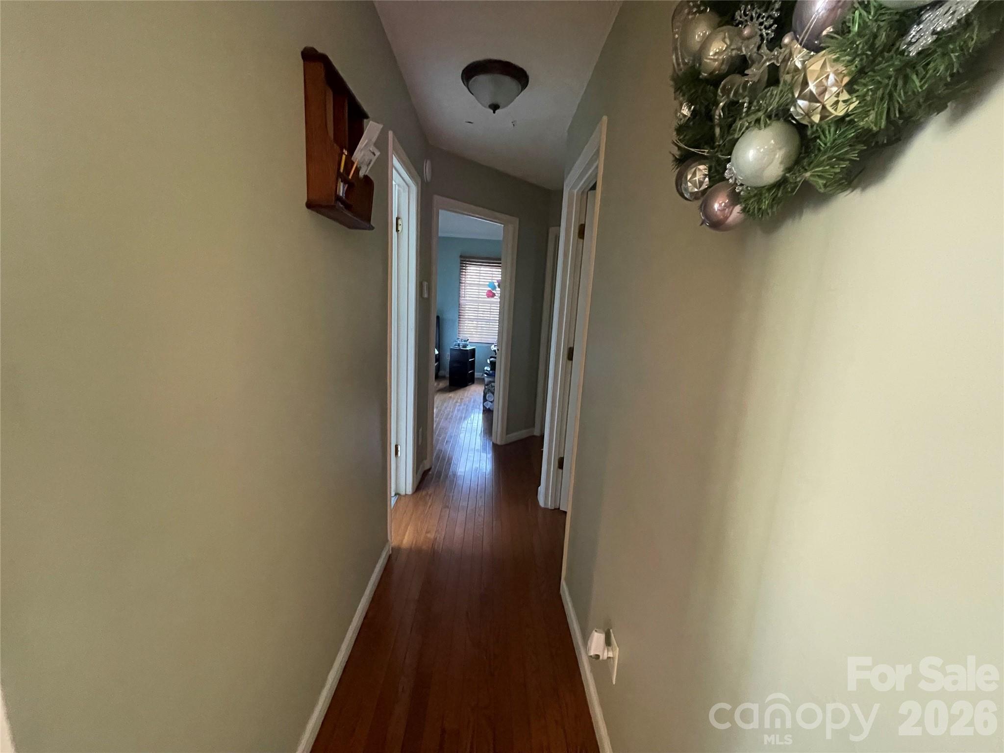 4907 Delmar Griffin Road Monroe, NC 28112 - Photo 9 of 25 a view of a hallway with wooden floor