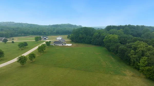 a view of a lake with a yard