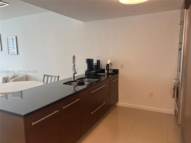 a view of a kitchen with a sink